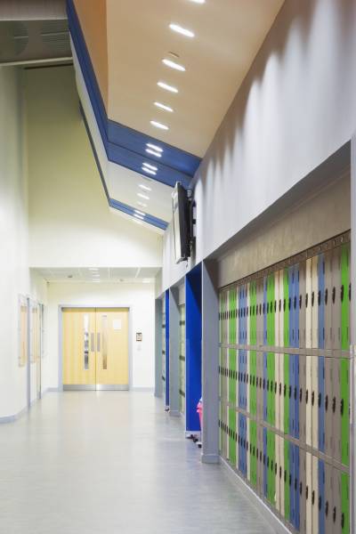 Corridor of modern secondary school with lockers.